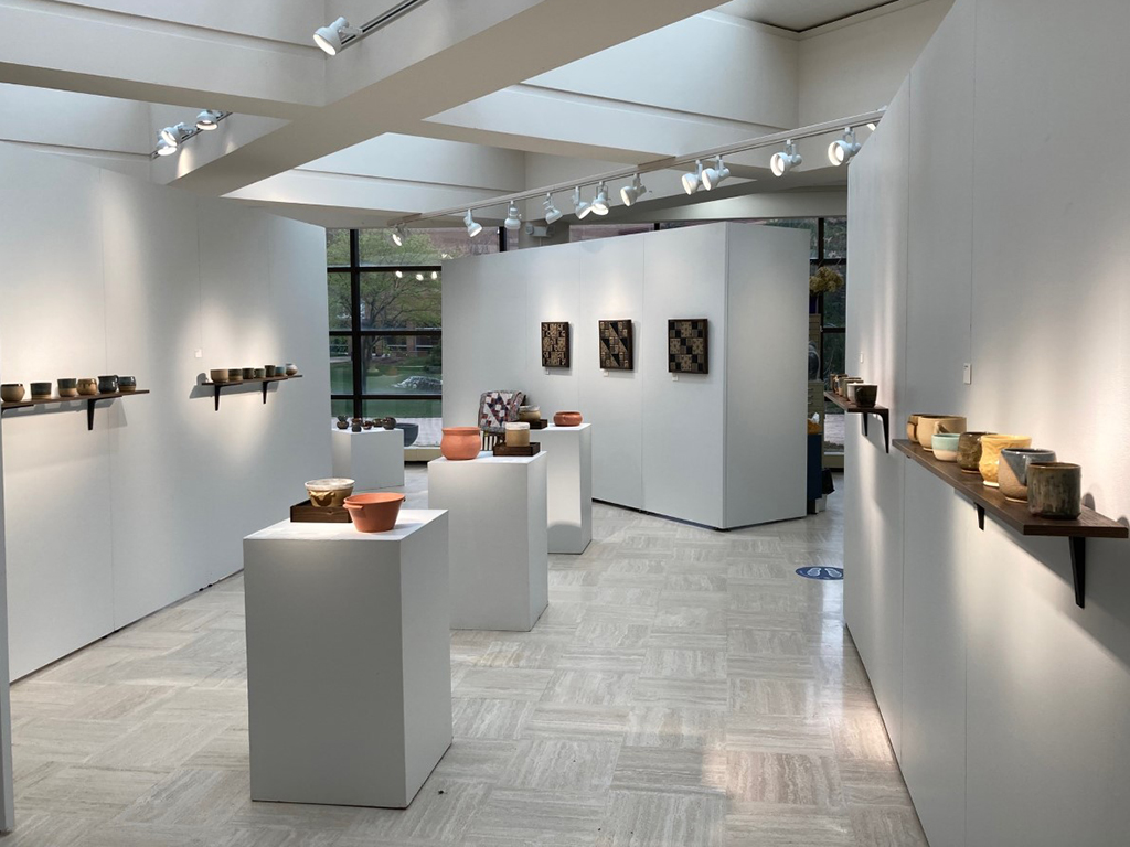 North view of bfa exhibition looking south with cooking vessels, cups, tile quilts